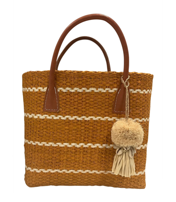 Through the Tuscan vineyards to the coast of Positano, this small, natural colored tote has it all! 