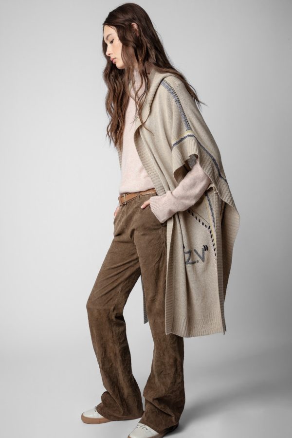 Hooded short sleeve cardigan is long and flowy. This layering piece has abstract stitching and the brand's ZV insignia with a cute tassel at the end of the hood. 